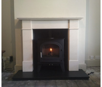 Cleanburn Skagen 5 Multifuel stove - installed with Flat Front Victorian limestone fire surround and riven slate hearths installed by our HETAS engineers in a traditional Victorian town house near Esher, Surrey.